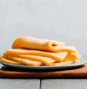 Plant-based processed style cheese slices
